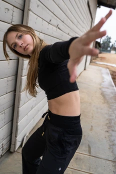 Serendipity dancer reaching toward the camera
